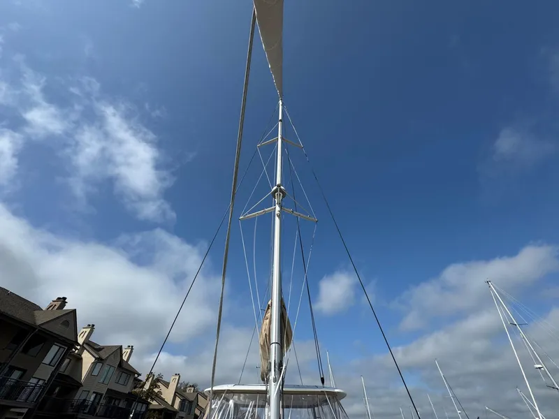 Slide: The Image of Sailboat mast of 2022 Lagoon 46 against a clear blue sky. - 15