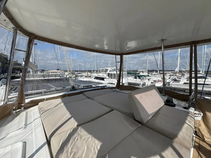 Slide: The Image of Luxurious interior of 2022 Lagoon 46 yacht with marina view and comfortable seating. - 29