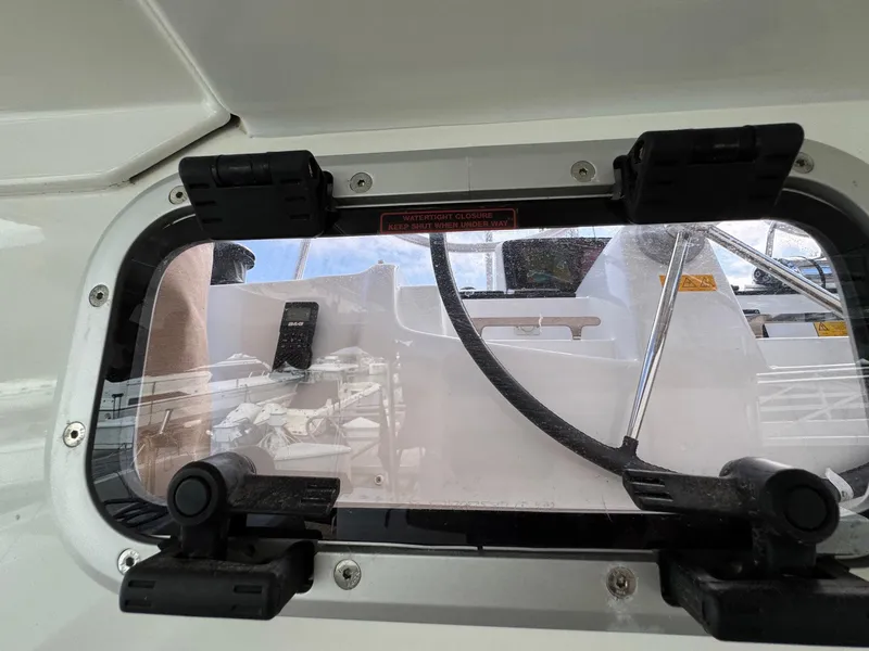 Slide: The Image of 2022 Lagoon 46 yacht window view with deck equipment visible. - 35