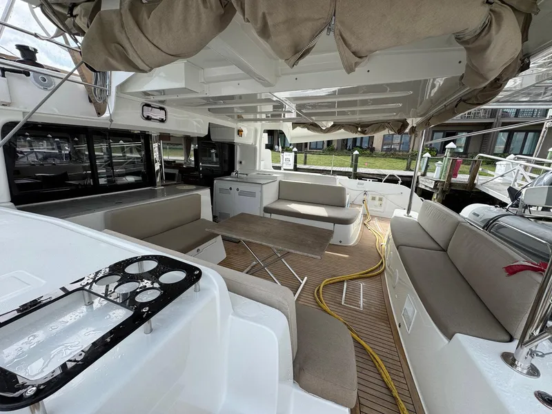 Slide: The Image of 2022 Lagoon 46 yacht interior with spacious seating and modern design. - 46