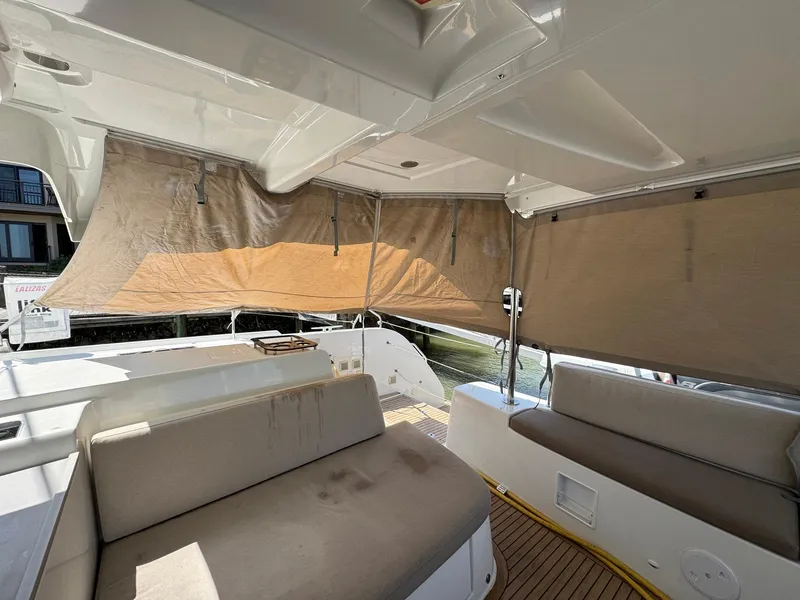 Slide: The Image of Spacious interior of 2022 Lagoon 46 yacht with beige seating and sunshades. - 48