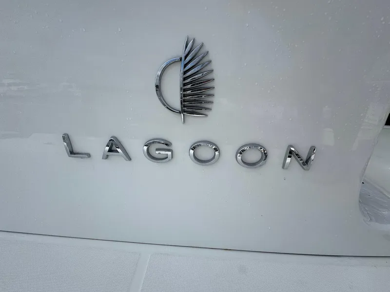 Slide: The Image of Lagoon 46 logo on a 2022 model yacht, featuring sleek metallic lettering. - 7