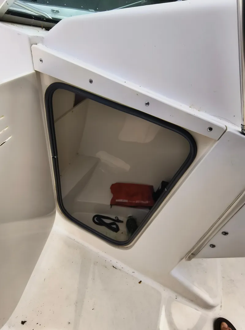 Slide: The Image of Storage compartment on a 2001 Boston Whaler 210 Ventura boat. - 12