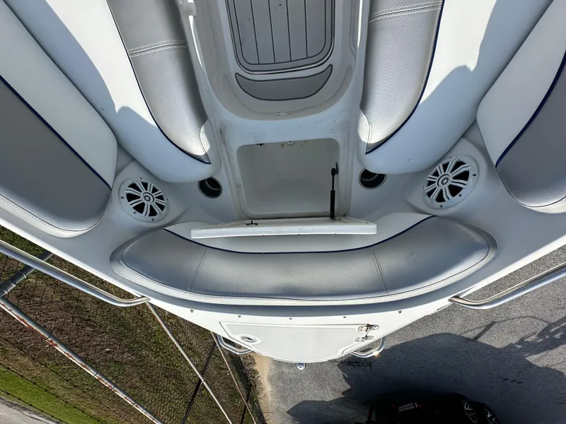 Slide: The Image of 2007 Ebbtide 2460 SS Fun Cruiser DC boat interior with seating and speakers. - 11