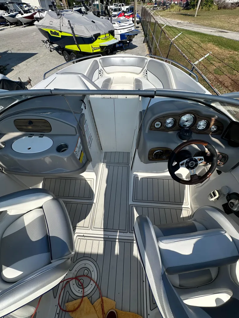 Slide: The Image of 2007 Ebbtide 2460 SS Fun Cruiser DC boat interior with steering wheel and seating. - 17