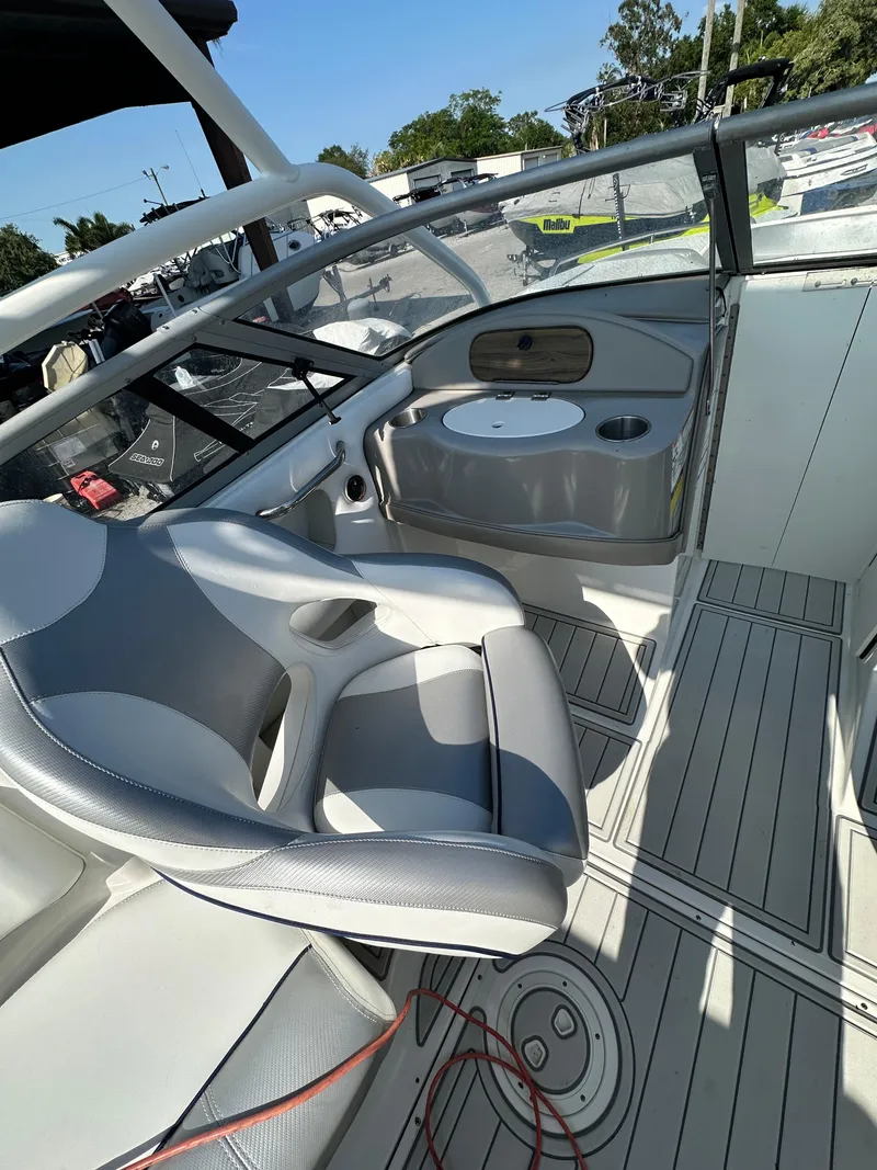 Slide: The Image of 2007 Ebbtide 2460 SS Fun Cruiser DC interior with seating and dashboard. - 18