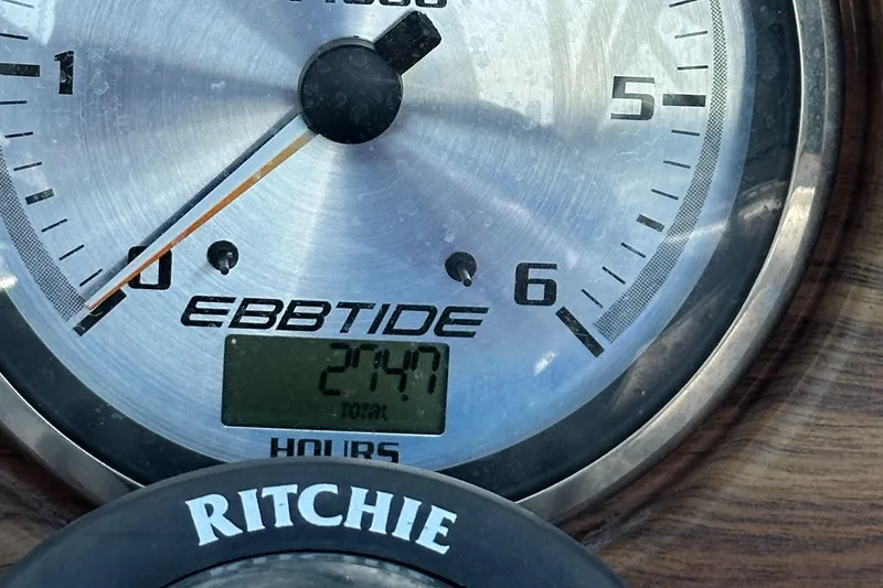 Slide: The Image of Close-up of Ebbtide 2460 SS Fun Cruiser DC 2007 gauge displaying 2747 hours. - 21