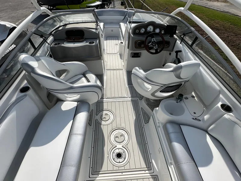 Slide: The Image of 2007 Ebbtide 2460 SS Fun Cruiser DC interior with seating and steering console. - 6