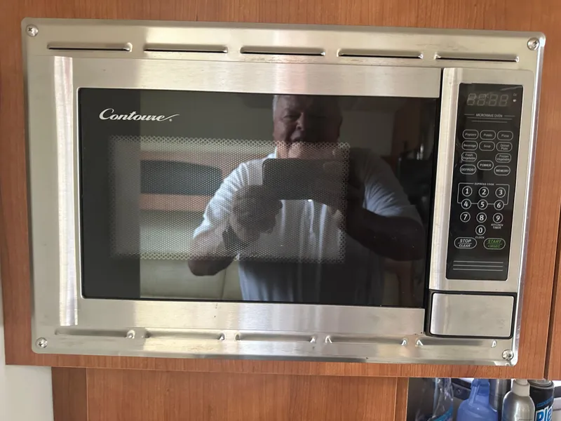 Slide: The Image of Contoure microwave oven in 2009 Cruisers 300 CXi Express boat interior. - 8
