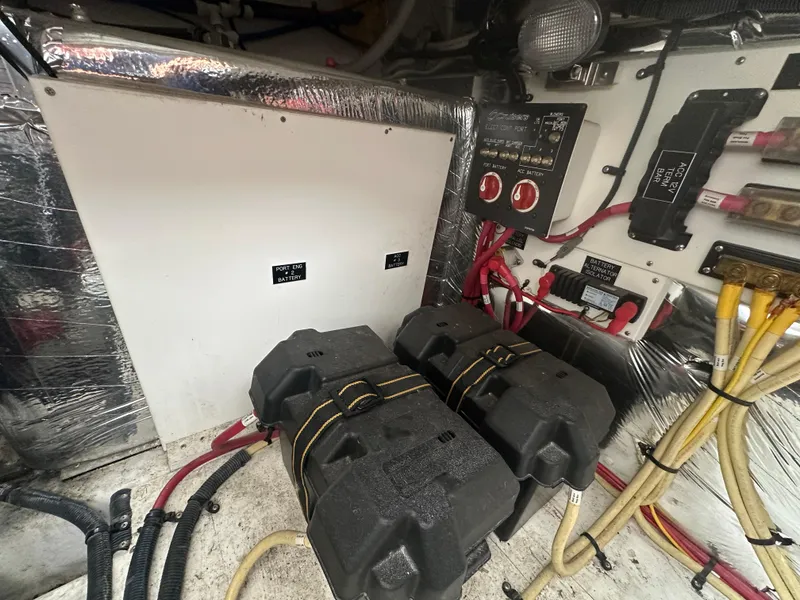 Slide: The Image of 2009 Cruisers 300 CXi Express engine room with batteries and electrical panel. - 19