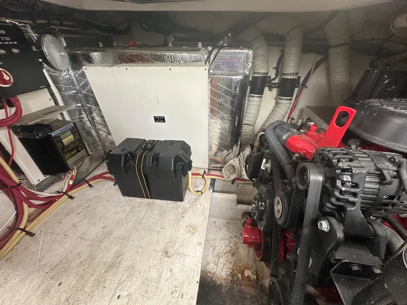 Slide: The Image of Engine room of 2009 Cruisers 300 CXi Express with visible components and wiring. - 22