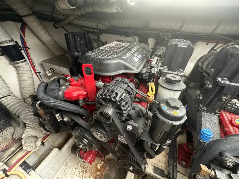 Slide: The Image of Engine compartment of a 2009 Cruisers 300 CXi Express boat, featuring Volvo Penta components. - 24