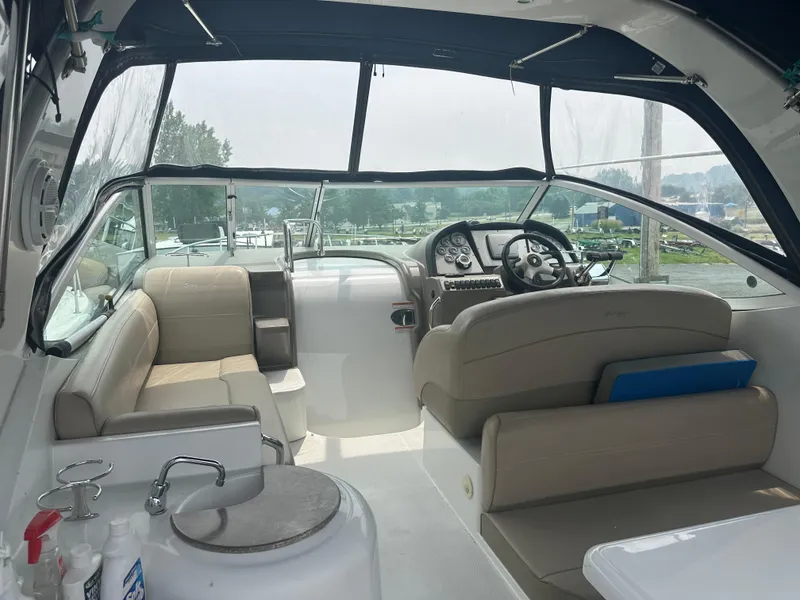 Slide: The Image of Interior of 2009 Cruisers 300 CXi Express boat with seating and steering area. - 3