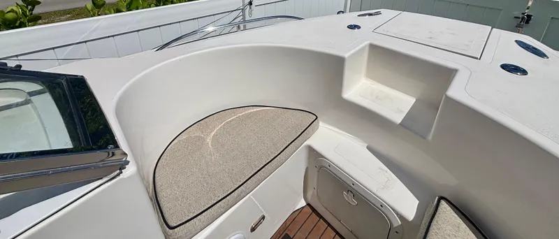 Slide: The Image of 2010 Westport 23 Custom Tender boat interior with seating and storage compartments. - 11