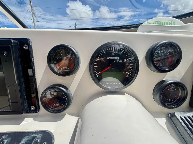 Slide: The Image of Instrument panel of 2010 Westport 23 Custom Tender with gauges and controls. - 19