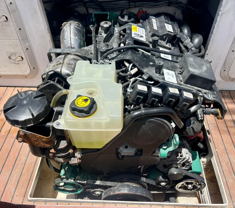 Slide: The Image of Engine of 2010 Westport 23 Custom Tender, showcasing intricate components and fluid reservoir. - 34