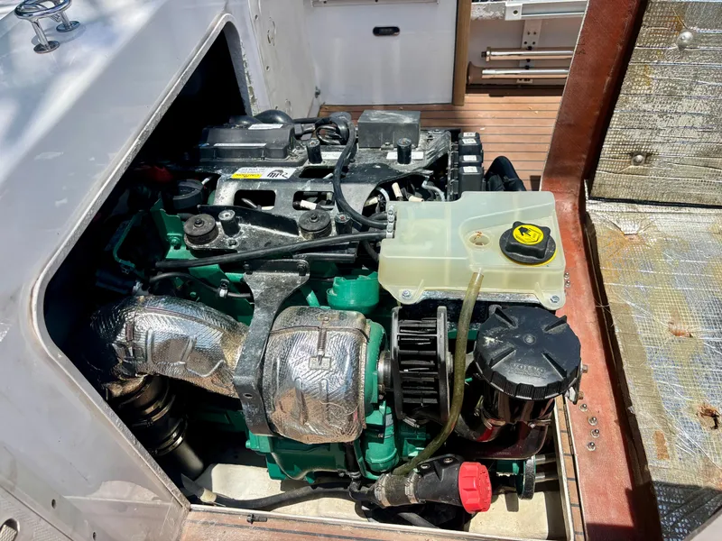 Slide: The Image of Engine compartment of a 2010 Westport 23 Custom Tender, showcasing detailed mechanical components. - 35