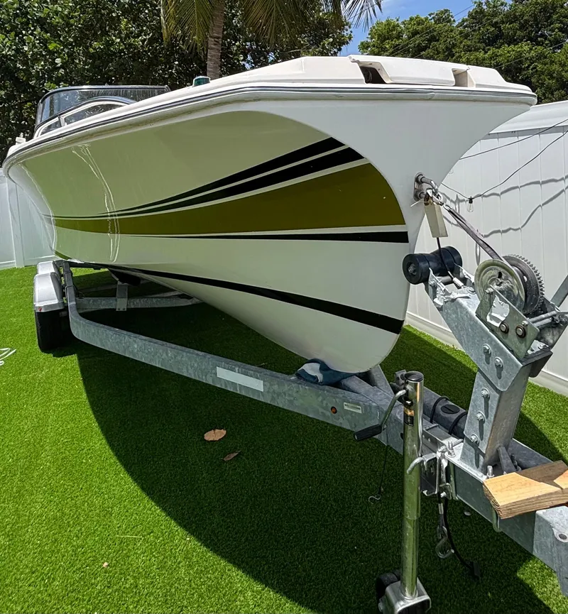 Slide: The Image of 2010 Westport 23 Custom Tender on trailer, parked on artificial grass. - 4