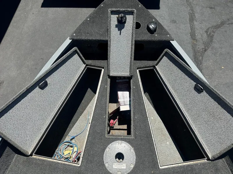 Slide: The Image of 2015 Lund 1625 Fury XL SS boat interior with open storage compartments. - 21