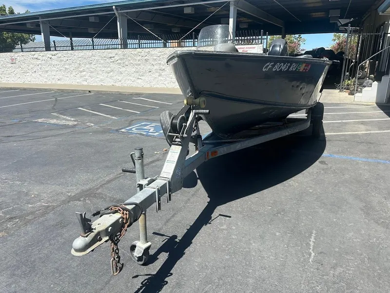 Slide: The Image of 2015 Lund 1625 Fury XL SS boat on trailer in parking lot. - 4