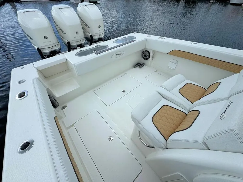 Slide: The Image of 2021 Blackwater 36 Sport boat interior with white and tan seating, ocean view. - 11