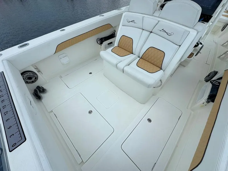 Slide: The Image of 2021 Blackwater 36 Sport boat with triple engines on open sea. - 12
