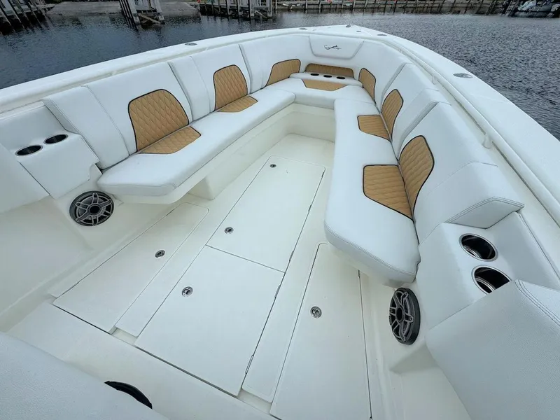 Slide: The Image of 2021 Blackwater 36 Sport boat with triple engines on open sea under blue sky. - 13