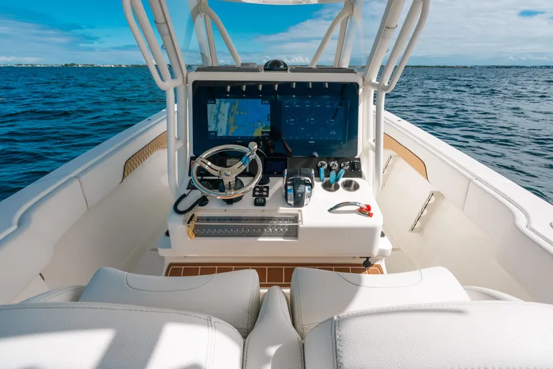 Slide: The Image of Cockpit view of 2021 Blackwater 36 Sport boat on open water. - 21