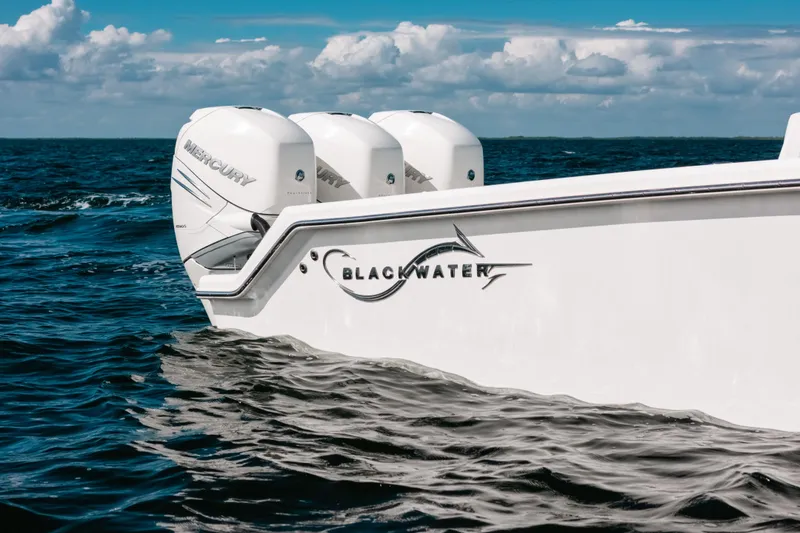 Slide: The Image of 2021 Blackwater 36 Sport boat with Mercury engines on open water. - 23