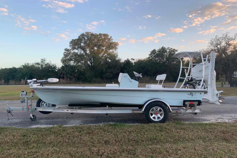 Slide: The Image of 2022 Beavertail Skiffs Vengeance boat on trailer, parked outdoors under a blue sky. - 1