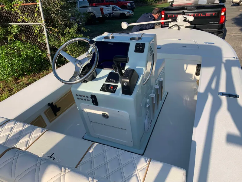 Slide: The Image of 2022 Beavertail Skiffs Vengeance boat interior with steering console and seating. - 11