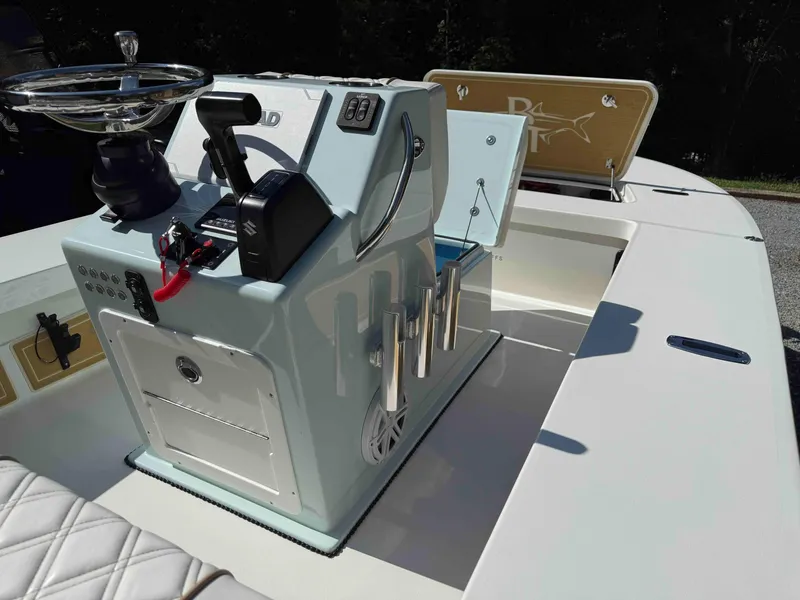Slide: The Image of 2022 Beavertail Skiffs Vengeance boat interior with steering console and rod holders. - 13