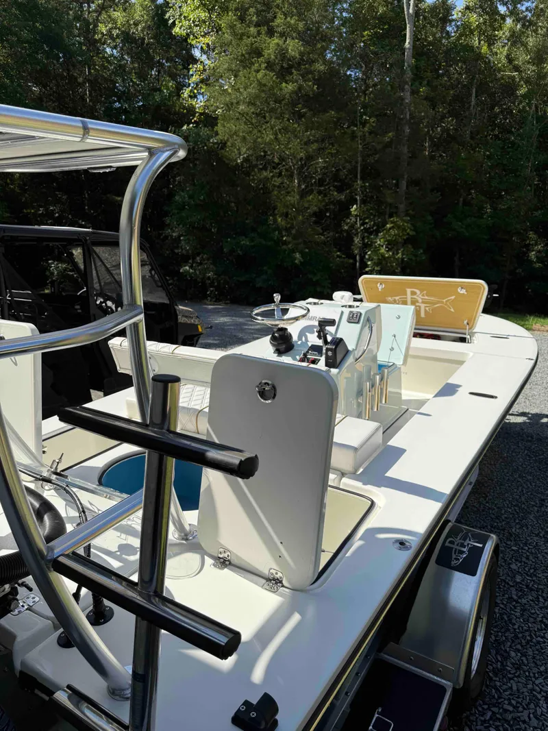 Slide: The Image of 2022 Beavertail Skiffs Vengeance boat with sleek design, parked outdoors. - 19