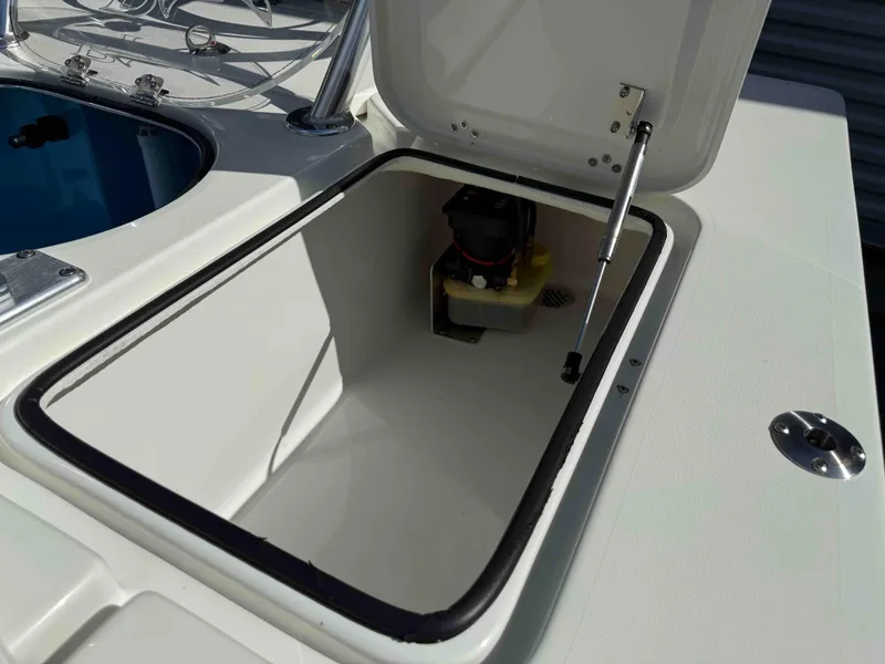 Slide: The Image of 2022 Beavertail Skiffs Vengeance storage compartment with open hatch and hydraulic support. - 21