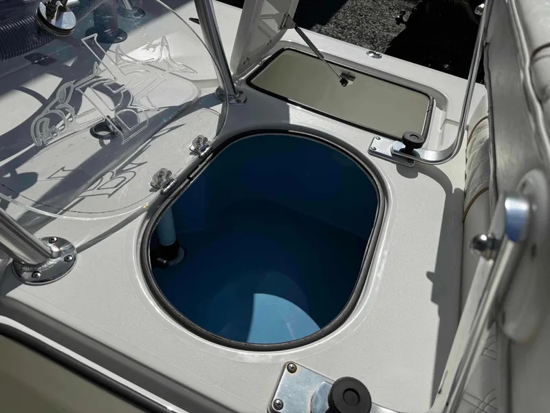 Slide: The Image of 2022 Beavertail Skiffs Vengeance boat interior with open storage compartment. - 22