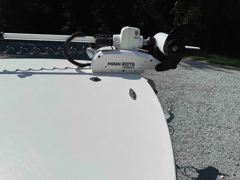 Slide: The Image of 2022 Beavertail Skiffs Vengeance with Minn Kota Terrova trolling motor on gravel surface. - 7