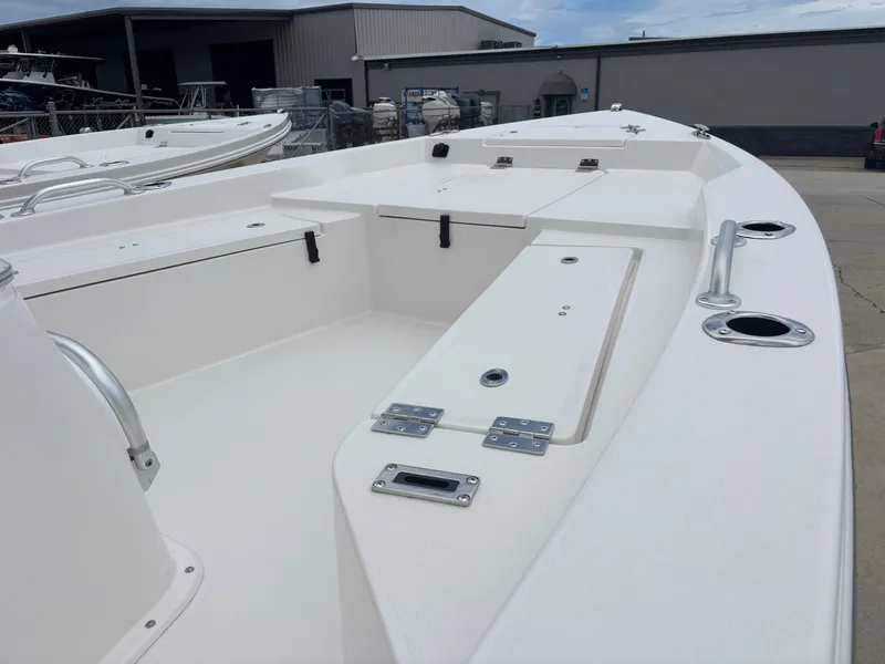 Slide: The Image of 2026 Bay Rider 219 Bay boat interior, featuring spacious deck and storage compartments. - 11