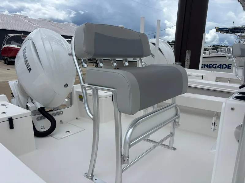 Slide: The Image of 2026 Bay Rider 219 Bay boat interior, showcasing sleek white design and storage compartments. - 14