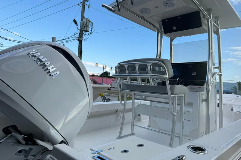 Slide: The Image of 2026 Bay Rider 219 Bay boat with Yamaha engine, sleek design, and modern console. - 35