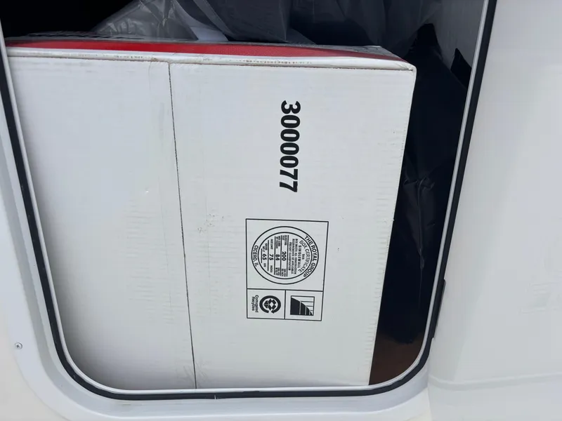 Slide: The Image of 2026 Bay Rider 219 Bay boat with T-top and speakers, viewed from below. - 9