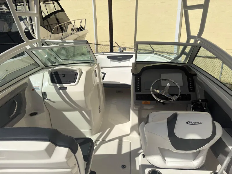 Slide: The Image of Open storage compartment on 2021 Robalo R247 Dual Console boat. - 15