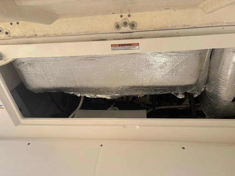 Slide: The Image of 2021 Robalo R247 Dual Console boat interior wiring and components. - 22