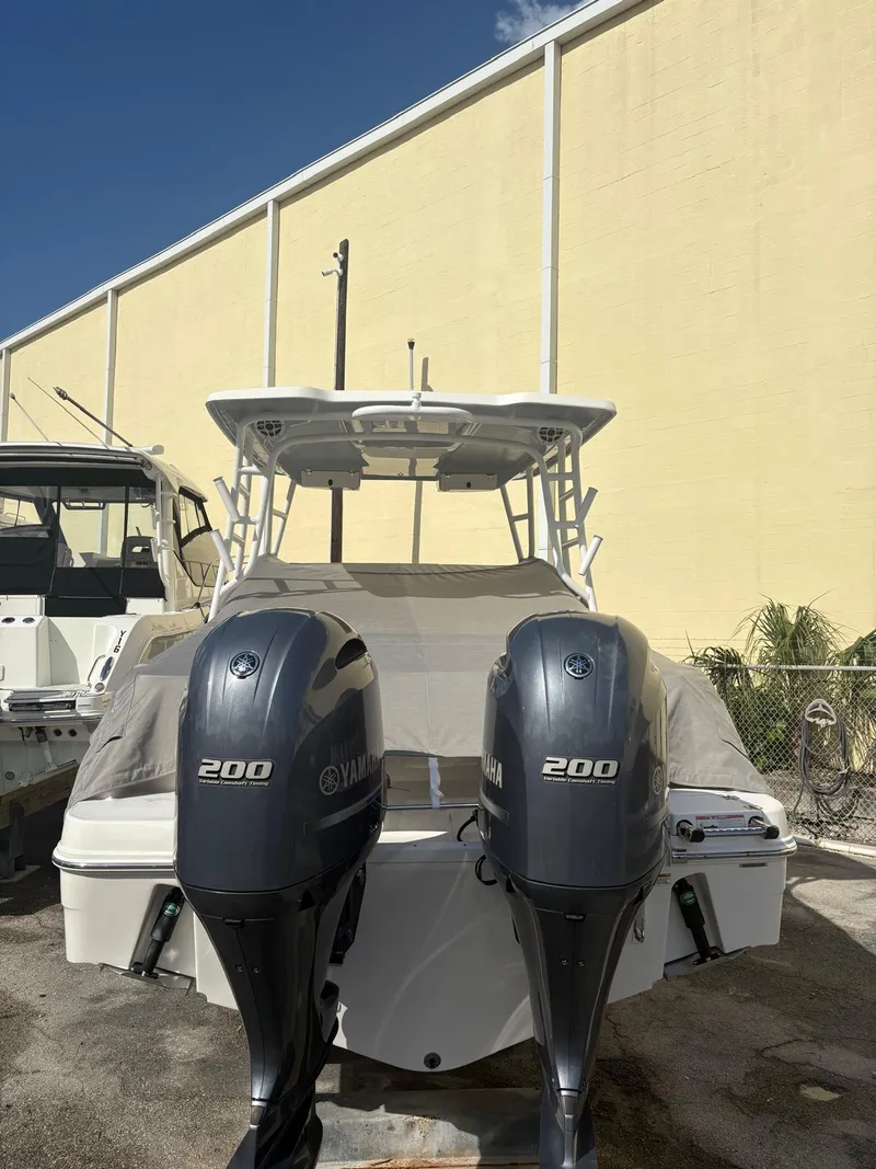 Slide: The Image of Twin Yamaha 200 engines on a 2021 Robalo R247 Dual Console boat. - 3