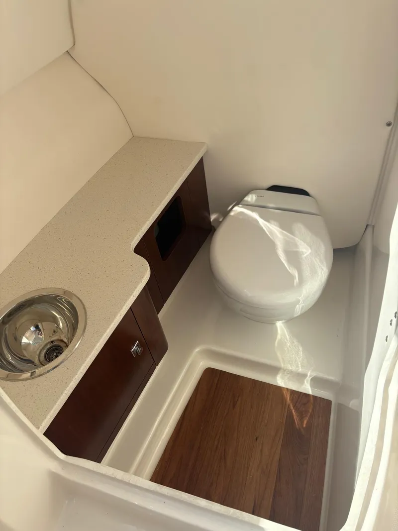 Slide: The Image of 2021 Robalo R247 Dual Console boat covered, with Yamaha outboard motor. - 4