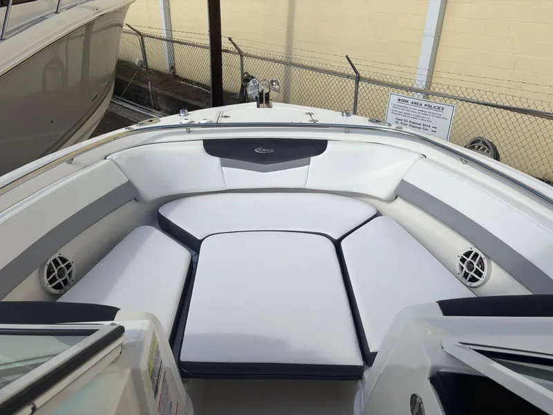 Slide: The Image of 2021 Robalo R247 Dual Console boat interior with sink and countertop. - 7
