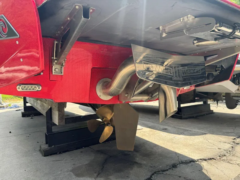 Slide: The Image of Rear view of 2022 Axis T250 boat with propeller and exhaust system. - 10