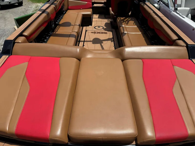 Slide: The Image of 2022 Axis T250 boat interior with tan and red seating. - 14