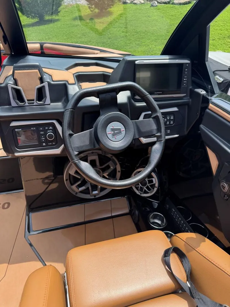 Slide: The Image of 2022 Axis T250 boat dashboard with steering wheel, controls, and display screen. - 18