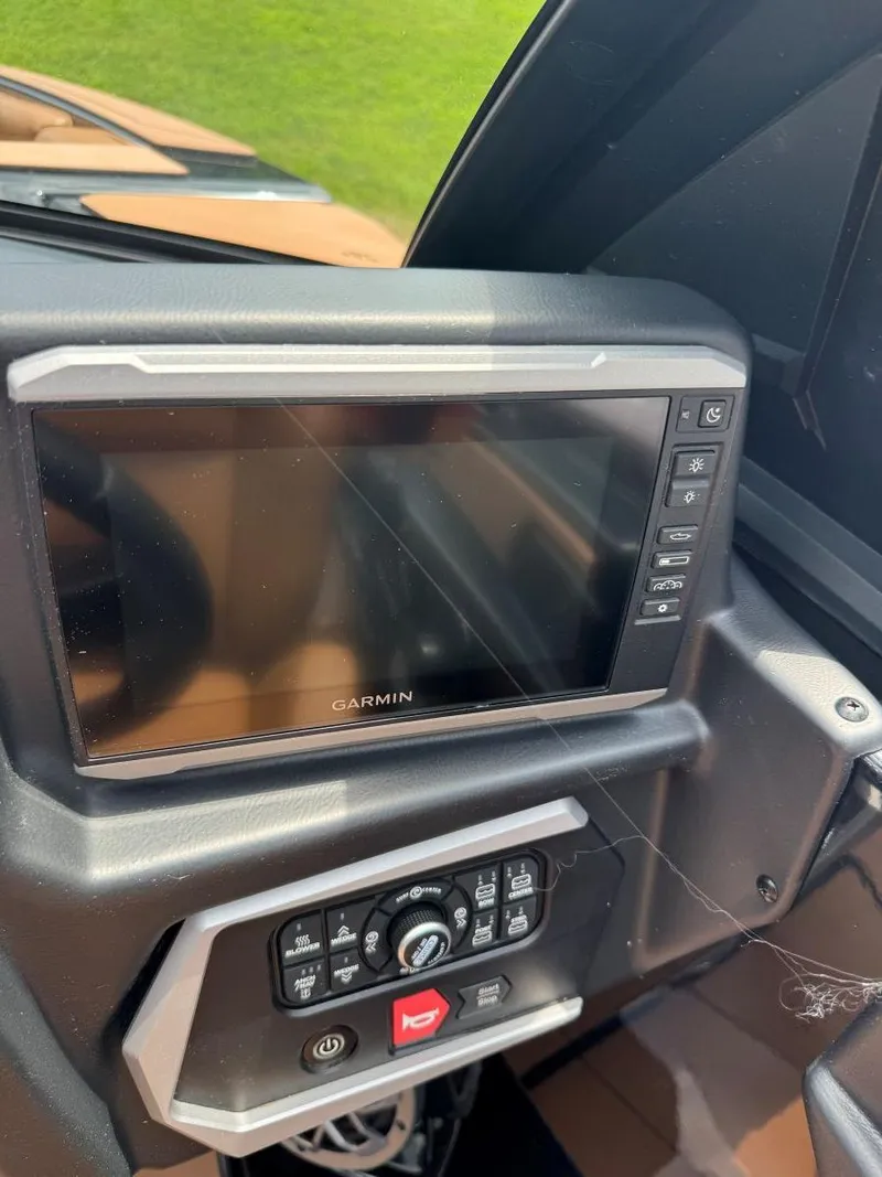 Slide: The Image of Dashboard of 2022 Axis T250 with Garmin display and control panel. - 34