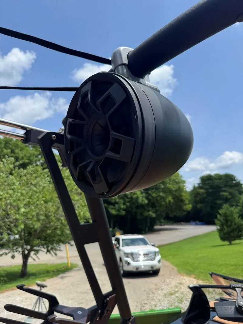 Slide: The Image of Outdoor speaker on Axis T250 boat, 2022 model, with a scenic background. - 36